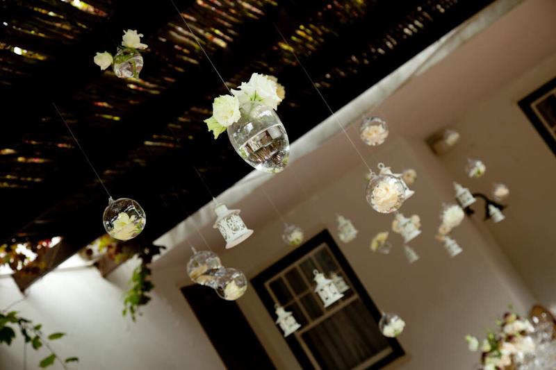 Unique reception decor- dangling white lights and bubbles accented with light yellow - photo by South Africa based wedding photographer Greg Lumley
